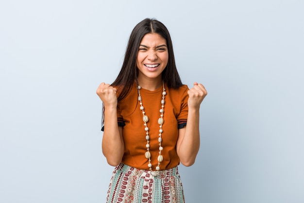 Young arab woman cheering carefree and excited. victory concept.