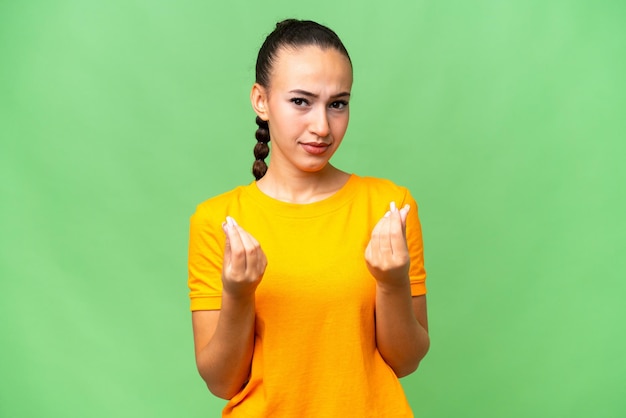 Young Arab woman over isolated background making money gesture but is ruined