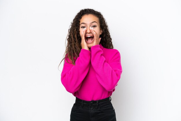 Young Arab woman isolated on white background shouting and announcing something