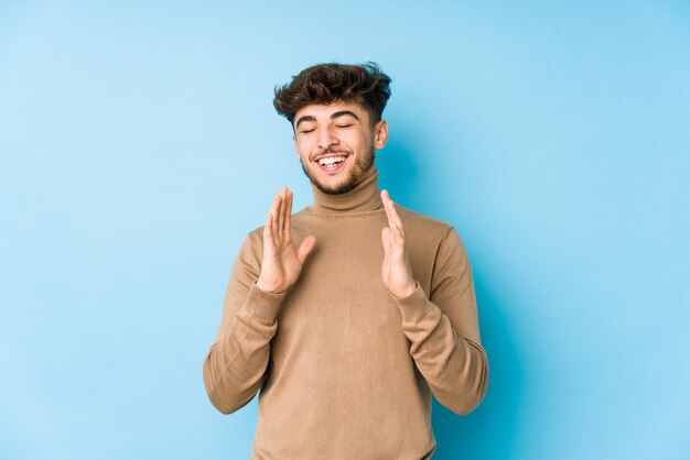 Young arabian man isolated joyful laughing a lot. Happiness concept.