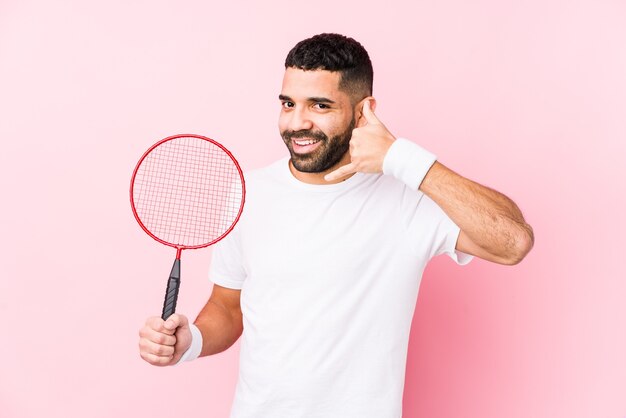 Young arabian man playing badminton