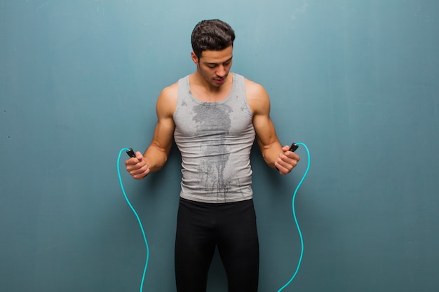 Young arabian man with a jump rope. sport concept