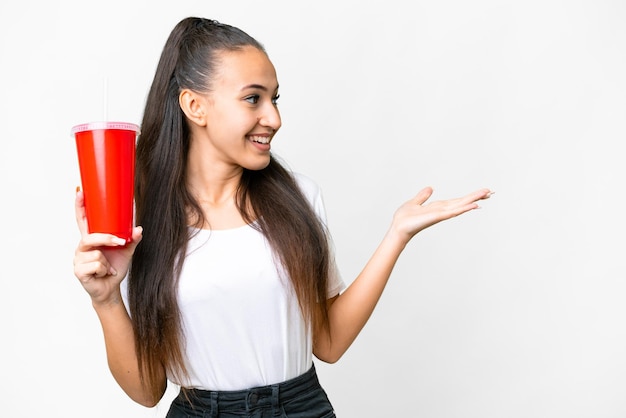 Young Arabian woman holding soda over isolated white background with surprise facial expression