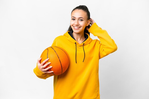 Young Arabian woman playing basketball over isolated white background having doubts