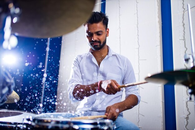 Young arabic man in a professional recording studio