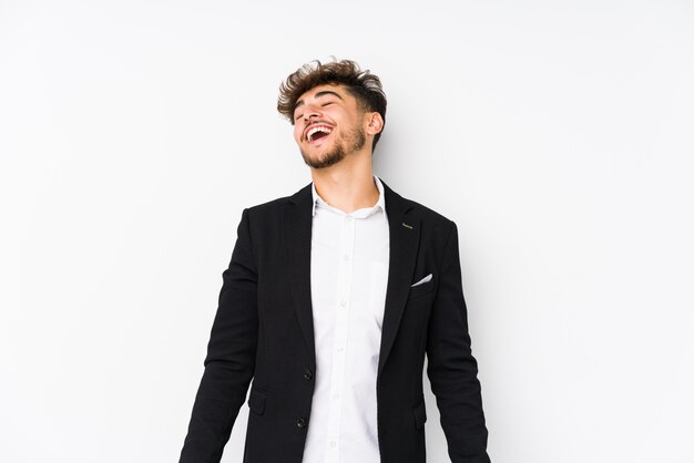 Young arabician business man isolated relaxed and happy laughing, neck stretched showing teeth.