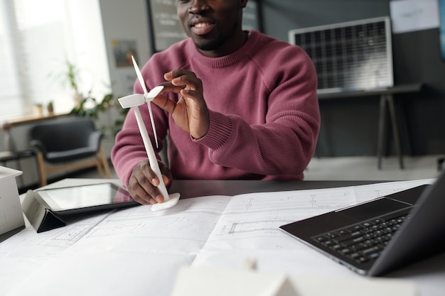 Young architect with windmill model