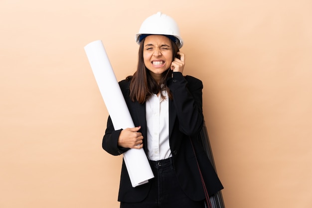 Young architect woman holding blueprints