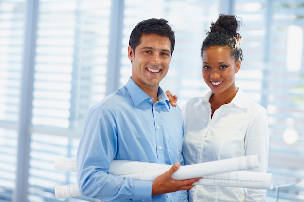 Young architects with confidence Portrait of confident young architects smiling together