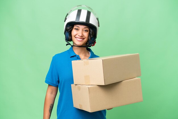 Photo young argentinian delivery woman over isolated background smiling a lot