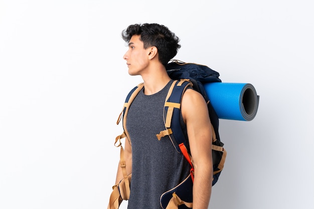 Young Argentinian hiker man looking side