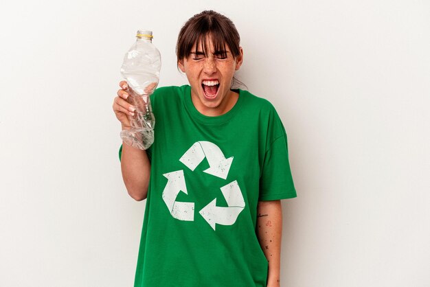 Young Argentinian woman recycled plastic isolated on white background