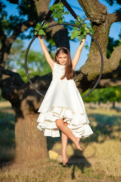 Young arial gymnastic athlet and tree view