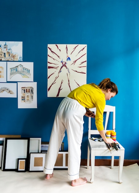 Young artist girl creaiting an artwork