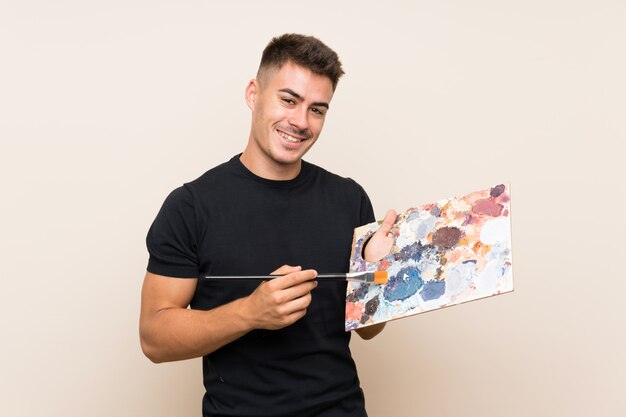 Young artist man with a paintbrush