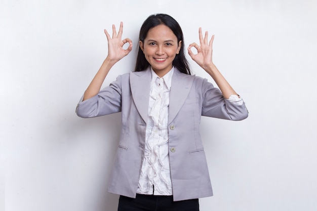 young asian beautiful business woman with ok sign gesture tumb up isolated on white background