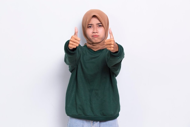 young asian beautiful muslim woman with ok sign gesture tumb up isolated on white background