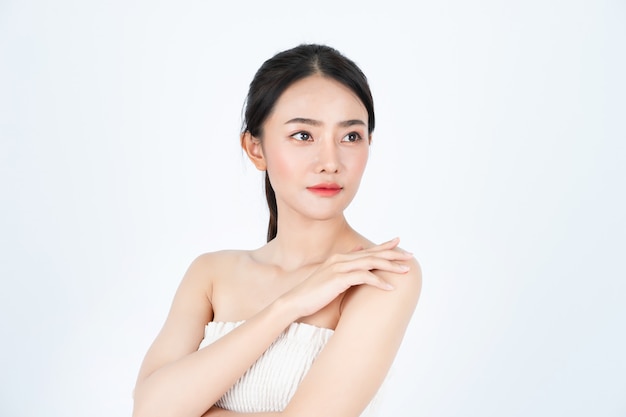 Young Asian beautiful woman in white undershirt, has healthy and bright skin.