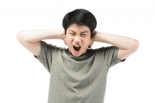 Young Asian boy over white background, be upset; have a bad temper emotional.