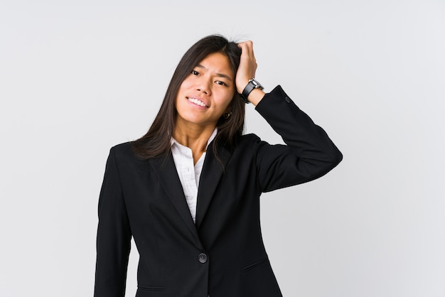 Young asian business woman being shocked, she has remembered important meeting.