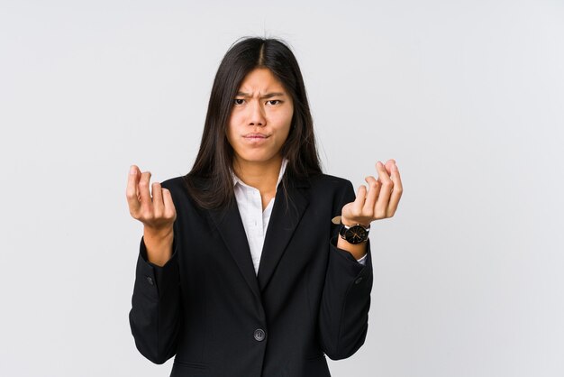 Young asian business woman showing that she has no money.