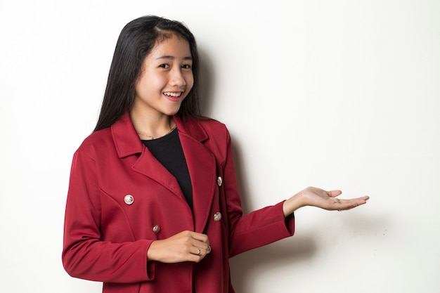 Young asian business woman on white background smiling confident pointing with fingers to different directions.