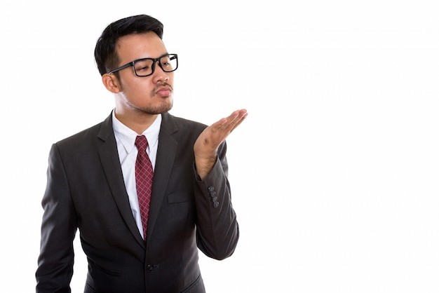 young Asian businessman giving flying kiss