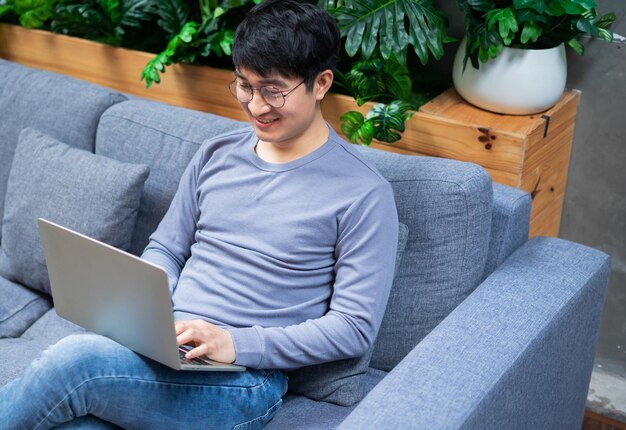 Young Asian businessman at home