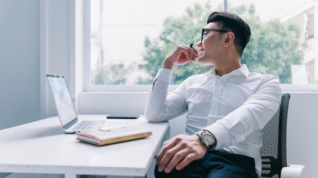 Young Asian businessman working at office