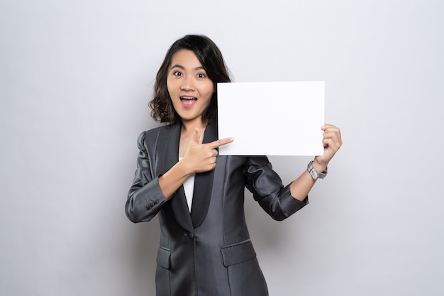 Young Asian businesswoman holding a paper