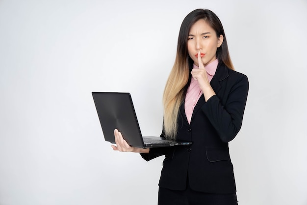 Young Asian businesswoman with laptop