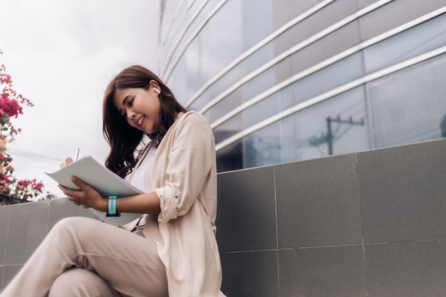 Young asian businesswoman working in the city Business concept