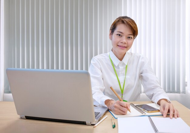 Young asian businesswoman working on a laptop