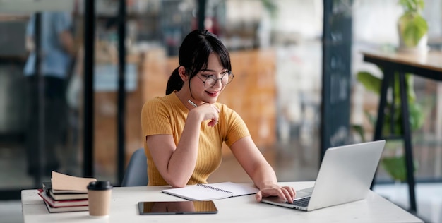 Young Asian businesswoman working at office