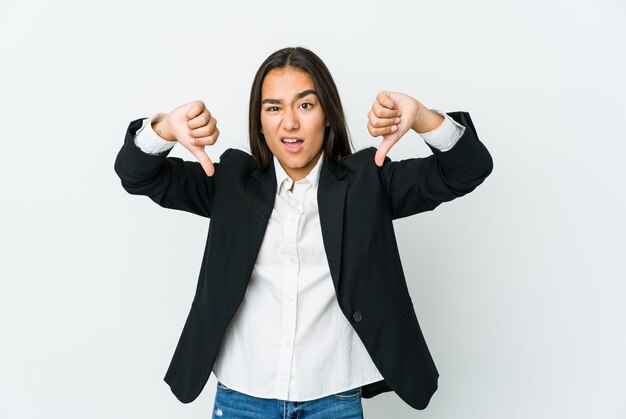 Young asian bussines woman isolated on white wall showing thumb down and expressing dislike.