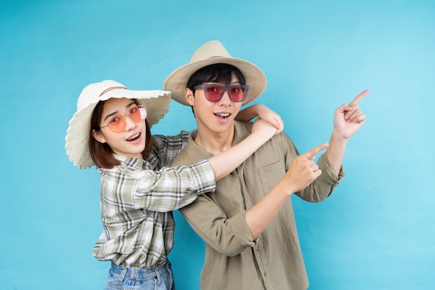 Young Asian couple happily traveling together