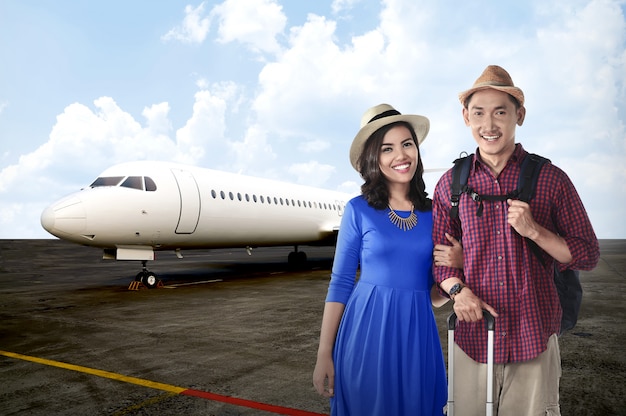 Young asian couple travel together with airplane