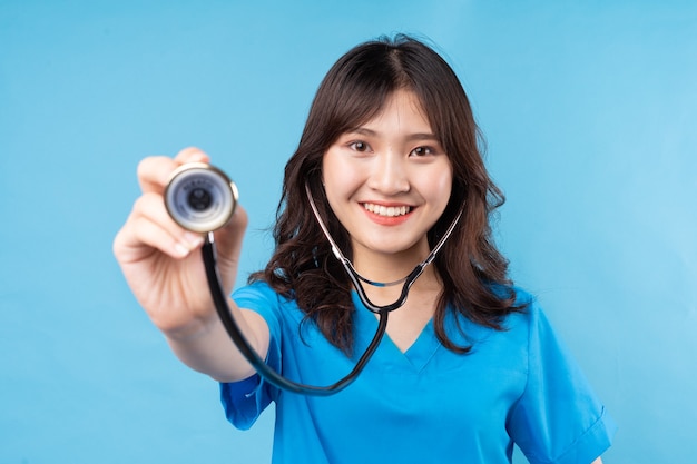 Young Asian female doctor need stethoscope laughing happily