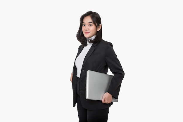 Young Asian female employees wear black suits with gestures holding laptop