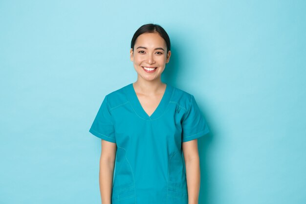 Young Asian female nurse posing