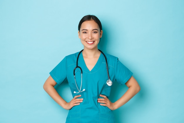 Young Asian female nurse posing