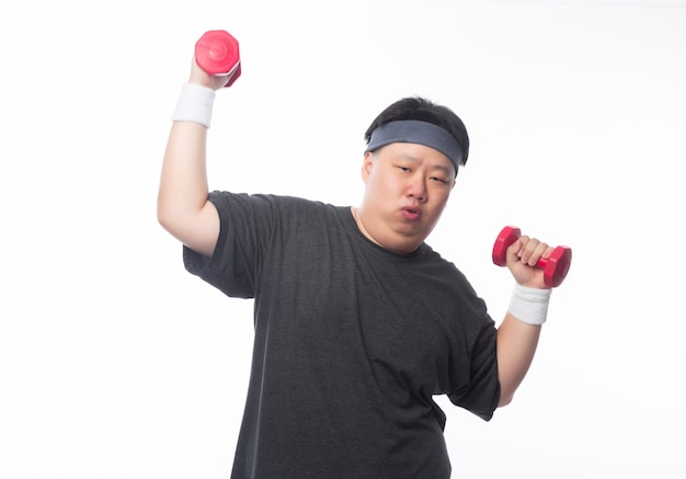 Young Asian funny fat sport man exercise with dumbbell isolated