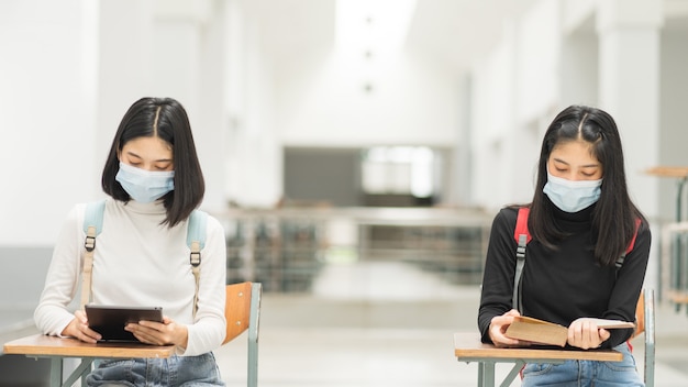 Young Asian girl students studying in classroom