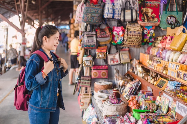 Young asian girl walking at Dumonoe saduak floating market, Thailand