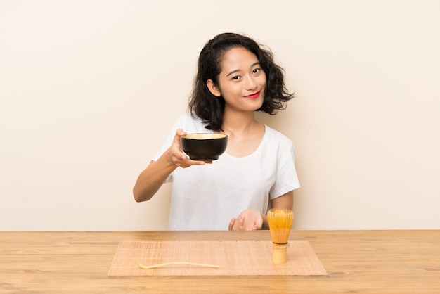 Young asian girl with tea matcha