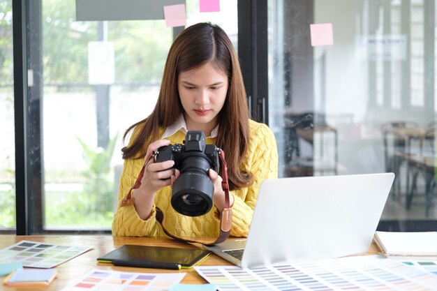 Young Asian Graphic Designer Working on Computer