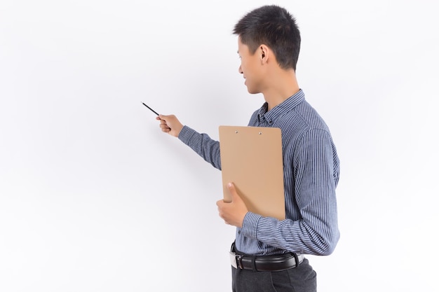 Young Asian male holding folder in front of white background