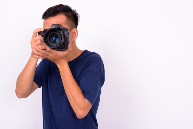 young Asian man against white space