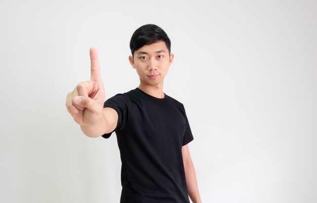 Young Asian man black shirt count one to ten by hand half body on white isolated background