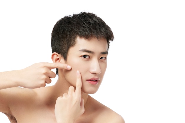 young asian man clean face with fresh healthy skin, isolated, beauty cosmetics and facial treatment